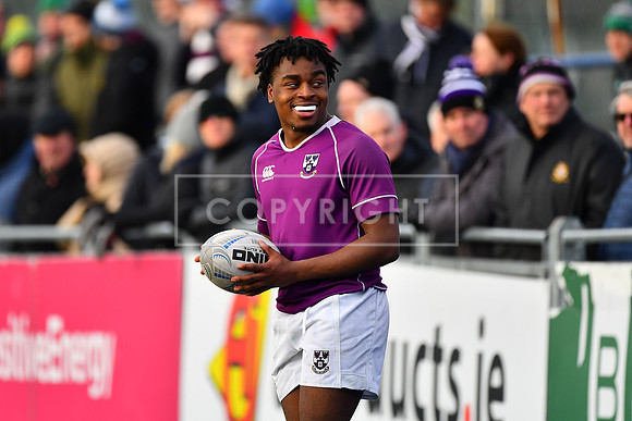 Kosi Ugwueru of Clongowes enjoying some of the banter from the Terenure fans.