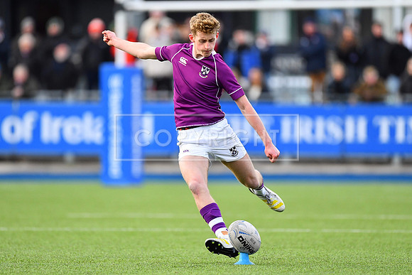 Clongowes outhalf Harry Mallon sends over a second-half penalty.