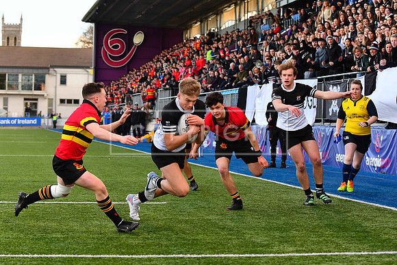 Ciar‡n Mangan of Newbridge College dives over for his side's second try of the game.