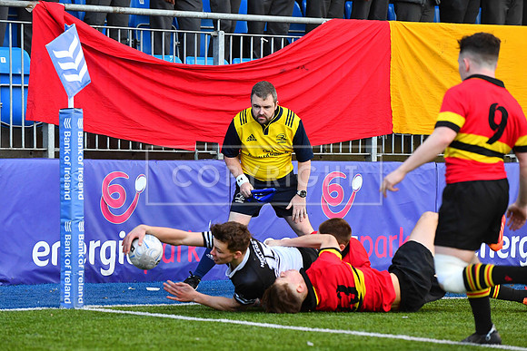 Newbridge College fullback Todd Lawlor stretches for the line.