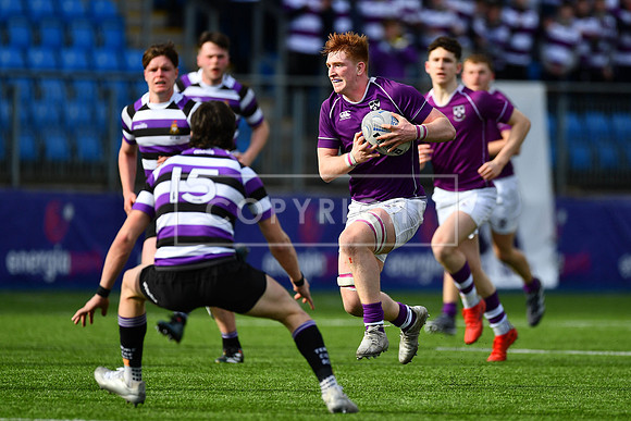 Captain Alex Kelly on the charge for Clongowes Wood.