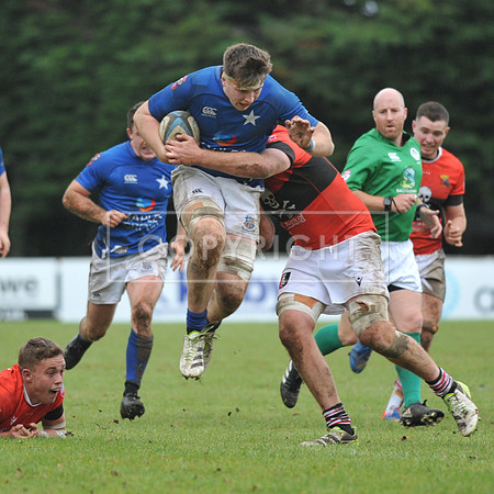 Daniel Leane of St. Mary’s College takes the aerial route.