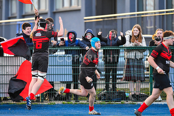 Kildare Town CS flanker Alex Downey celebrates a Kildare try with their supporters.