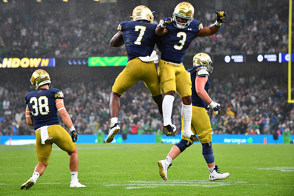 Gi'Bran Payne and Audric Estime celebrate the touchdown.