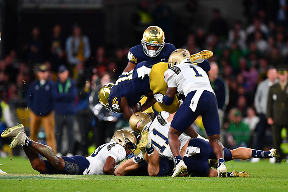 Jeremiyah Love is upended by Dashaun Peele