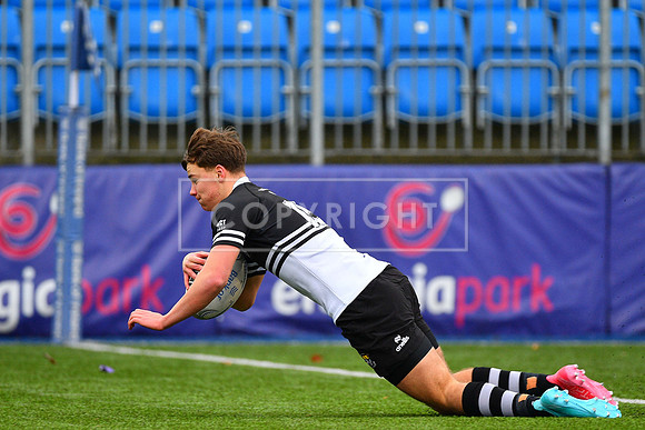 Newbridge College fullback Todd Lawlor with a first half try.
