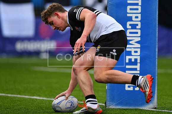 Newbridge College inside centre Paddy Taylor with a first half try.